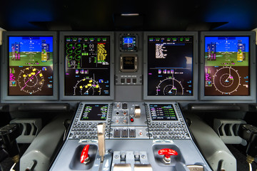 Wall Mural - Closeup high detailed view on engine power control and other aircraft control unit in the cockpit of modern civil passenger airplane