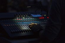 A Man Hand On A Mixing Console Changing Sound Volume