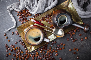 Wall Mural - Black coffee in a cup on old background