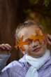 © Intel - Happy girl laughing and playing in autumn leaves