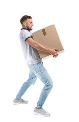Poster - Full length portrait of young man carrying carton box on white background. Posture concept