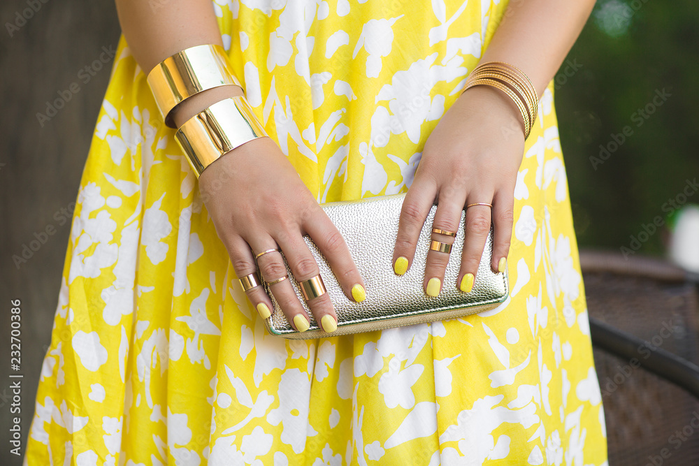 Unrecognizable woman holding wallet in her hands. Lady`s hands wearing ...