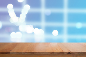 Canvas Print - wooden desk with blue gradient tone abstract background bokeh circles for christmas background
