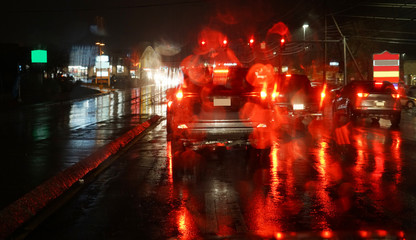 Wall Mural - street night view in rain through car window