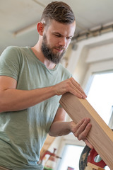 young worker in a carpenter's workshop