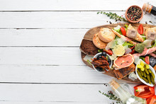 A Set Of Food. Snacks Of Italian Cuisine. On A Wooden Background. Top View. Free Copy Space