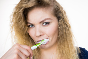 Wall Mural - Woman brushing cleaning teeth