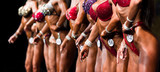 group woman athletes bodybuilders posing most muscular bikini fitness competitions