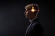 Profile of a young man with a light bulb in his head. Concept of idea birth.