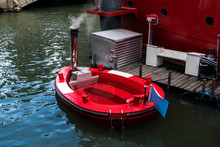 Red Hot Tag With Melted Stove In Rotterdam. The Hot Tub Concept In A Floating Wood-fired Jacuzzi That Can Be Booked For A Unique Recreational Boat Channel Trip In Europe