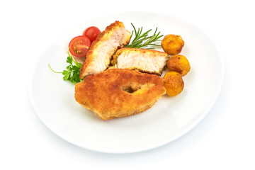 Delicious Battered Fish Fillet with herbs, pepper and tomatoes, isolated on a white background. Close-up