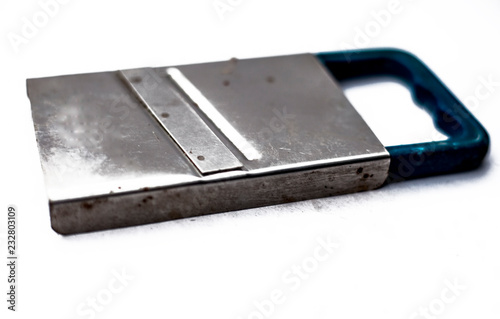 Fotografie, Obraz Close up of small slicer used to slice vegetables while making salad,Isolated on white