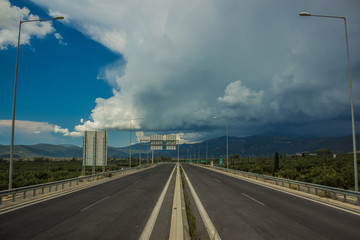 empty symmetry shot of two stream road highway in mountain tropic landscape district part of the Earth in fresh cloudy weather before storm 