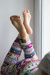 © yursavieno - Sexy and beautiful female soles and feet crossed on windowsill