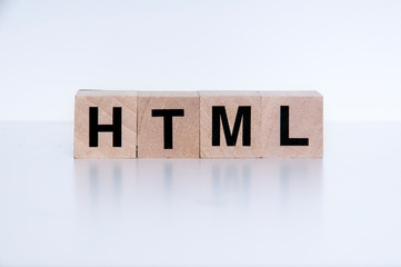 HTML, wood cubes and white background