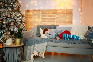 Wall Mural - Little boy sleeping on bed at home on Christmas Eve