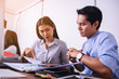 © only_kim - Businessmen and businesswomen discuss work at table with devices in hands isolated