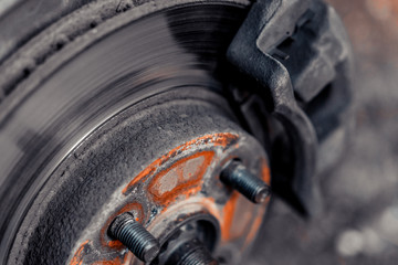 Wall Mural - Closeup of brake disc and car wheel caliper.