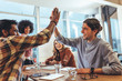 © Jacob Lund - Business colleagues giving high five