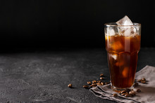 Tall Glass Cold Brew Coffee With Ice On Black Or Dark Background