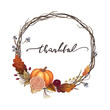 thankful thanksgiving wreath with an orange pumpkin, autumn flowers, vines, branches, grapes, fall leaves and lettering. orange and red autumn thanksgiving calligraphy illustration fall season themed.