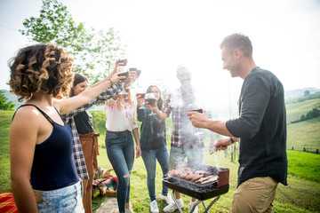 Wall Mural - Group of friends eating in the nature