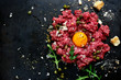 Beef tartare - traditional dish of french cuisine.Top view.