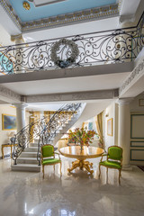 luxury lobby interior. Staircase with handmade wrought Iron Railing