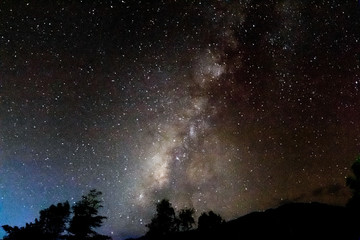 Wall Mural - milky way in the darkest night with beautiful mountain shape.