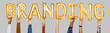 © Rawpixel.com - Hands holding branding word in balloon letters