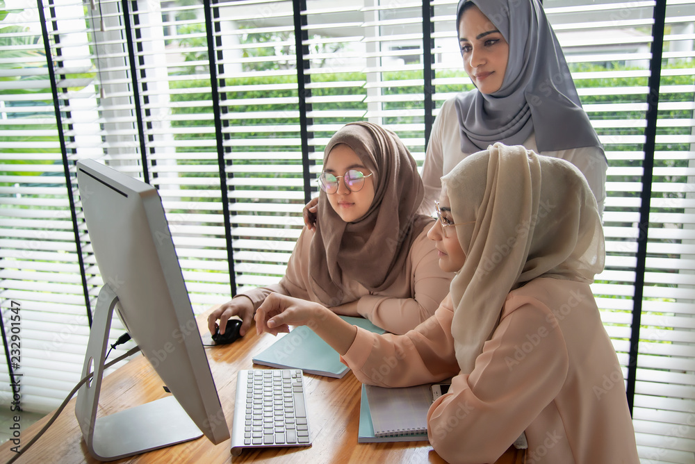 Muslim students using and learning with computer. Stock Photo | Adobe Stock