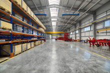 Large, Spacious Assembly Shop. High Storage Racks With Wooden Boxes
