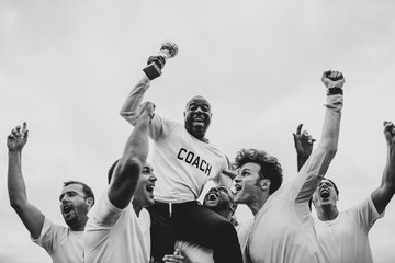 Soccer players team celebrating their victory