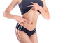 © Stavros - Cropped shot of fit woman's torso with arrowon body hands showing waist