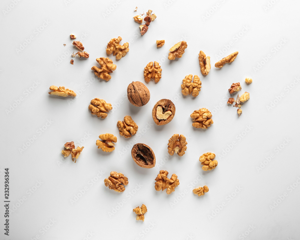 Tasty walnuts on white background