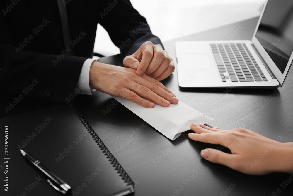 Businessman taking envelope with bribe from woman. Corruption concept