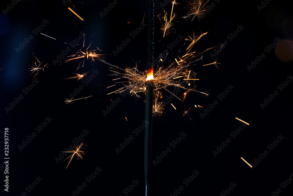 Festive Christmas sparkler on dark background