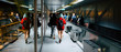 © simona - People travelers in the airport ready to flight or just arrived to the new destination. work or business travel concept for mixed people moving inside the gate