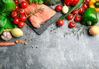 Poster - Raw fishes and vegetables on stone background