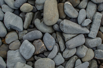 Wall Mural - Background photograph of some stones of a Menorca beach.