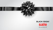 Black bow with horizontal ribbon with shadow and inscription Black Friday Sale on white background