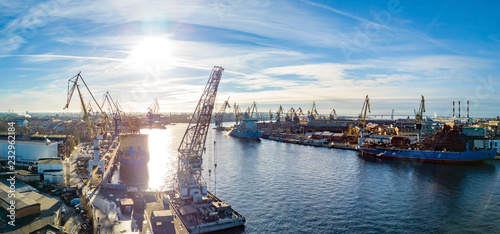 Fotomural Aerial; drone view of port with shipyard silhouettes on the horizon; industrial