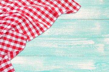 Wall Mural - Vintage wooden table with red checkered tablecloth. Top view mockup.