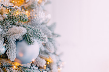 decorated xmas tree on white wall background
