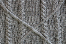 Closeup Of Gray Wool With A Braid And Aran Pattern