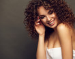 © opolja - Fashion studio portrait of beautiful smiling woman with afro curls hairstyle. Fashion and beauty.