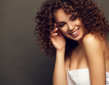 Fashion Studio Portrait Of Beautiful Smiling Woman With Afro Curls Hairstyle. Fashion And Beauty.
