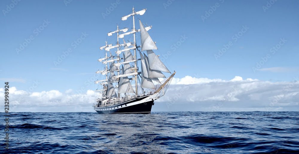 Sailing ship under white sails at the regatta - obrazy, fototapety, plakaty 