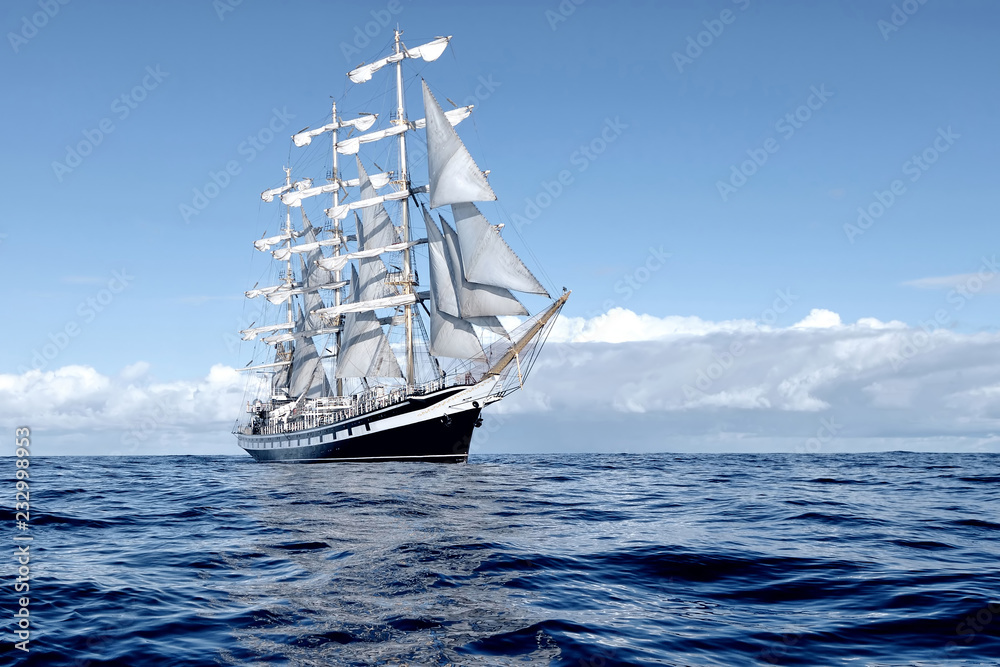 Sailing ship under white sails at the regatta - obrazy, fototapety, plakaty 