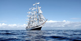 Sailing ship under white sails at the regatta